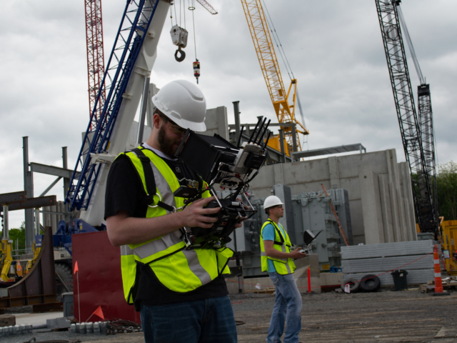 Drone flying at a large construction site